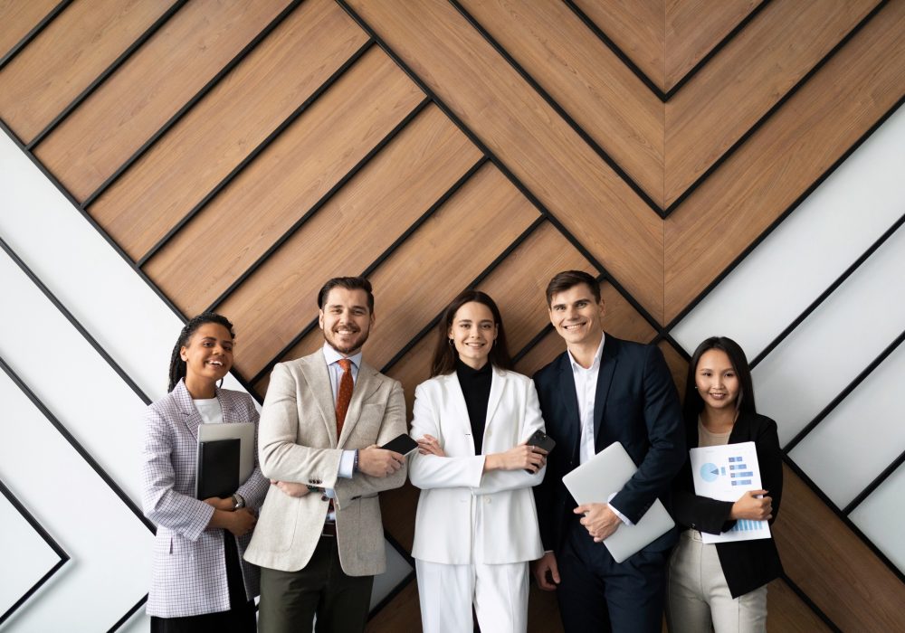 smiling young and old multiracial workers staff group pose together as human resource